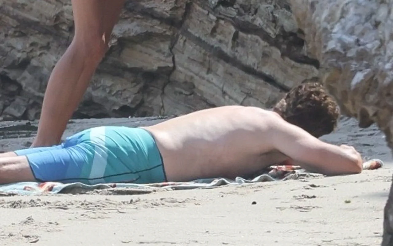 Gerard Butler sunbathing