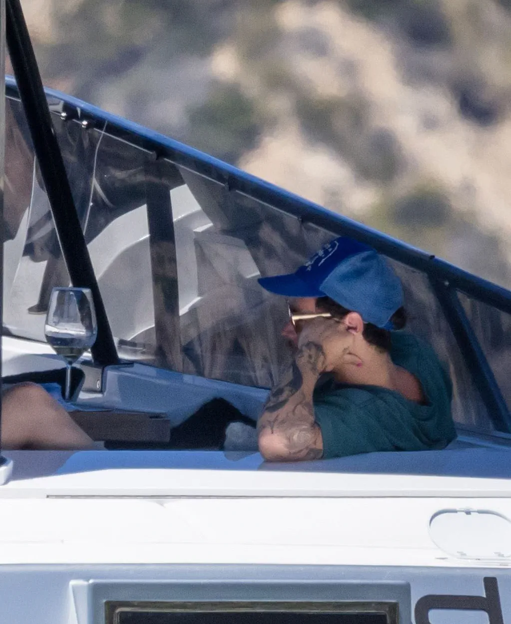 Harry Styles sunbathing